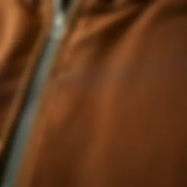 Close-up of fabric texture of a brown zip hoodie highlighting quality materials