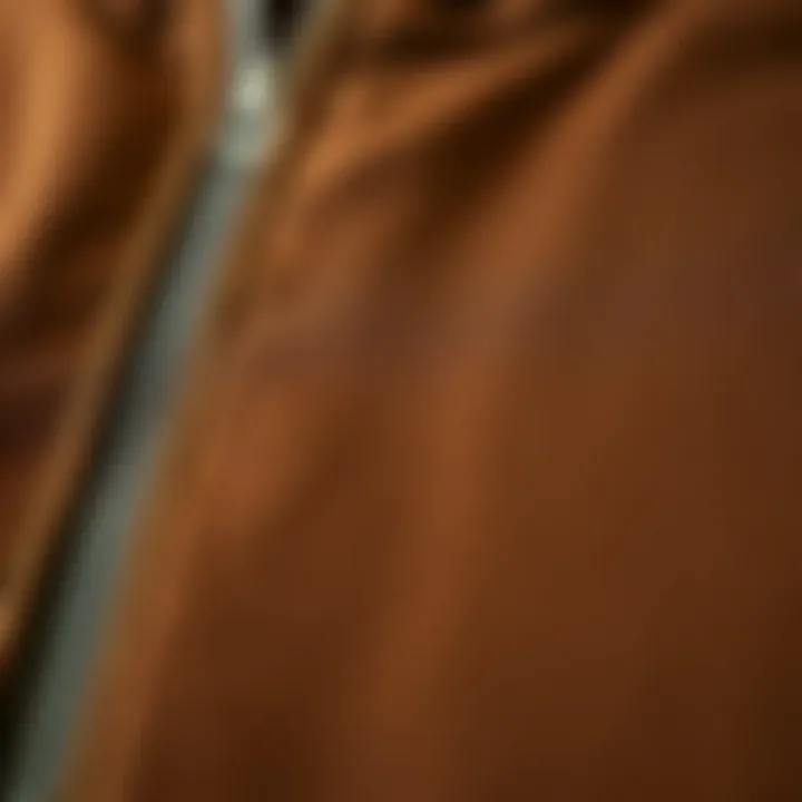 Close-up of fabric texture of a brown zip hoodie highlighting quality materials