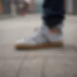 Close-up of adidas grey suede shoe on a skateboard deck