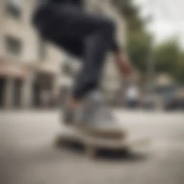 Skateboarder performing a trick wearing adidas grey suede shoes