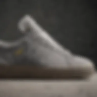 Side profile of adidas grey suede shoes highlighting texture