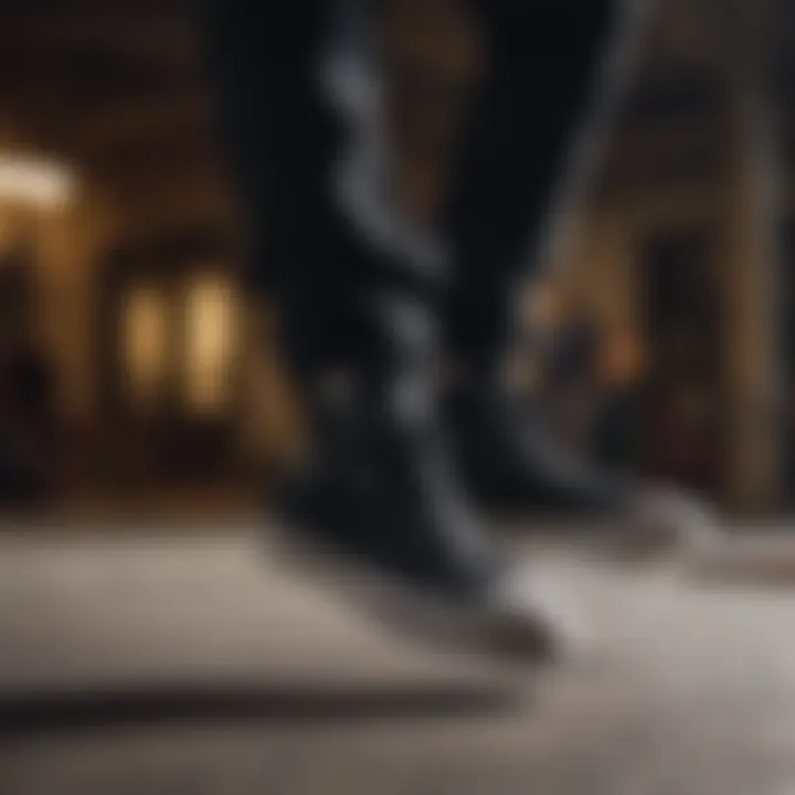 A skateboarder executing a trick while wearing black on black Converse high tops.