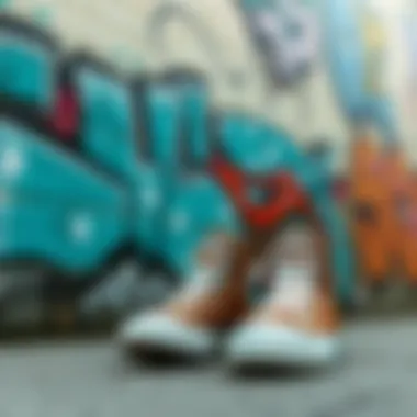 A stylish pair of brown Converse high tops against a graffiti wall