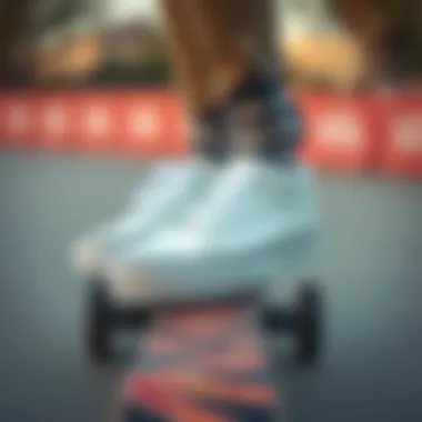 Classic White Vans on Skateboard A classic pair of white Vans sneakers on a skateboard deck