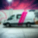 A stylish white van with a striking pink stripe parked against a vibrant skate park backdrop.