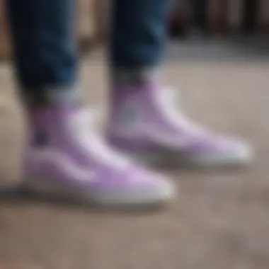 Person customizing lilac high top Vans with unique patches