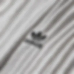 Close-up of the adidas white tee shirt showcasing fabric texture and design details