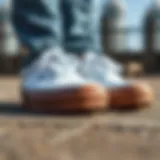 Detailed View of White Vans with Brown Soles Close-up of white Vans showcasing the texture of the material and the contrast of the brown sole