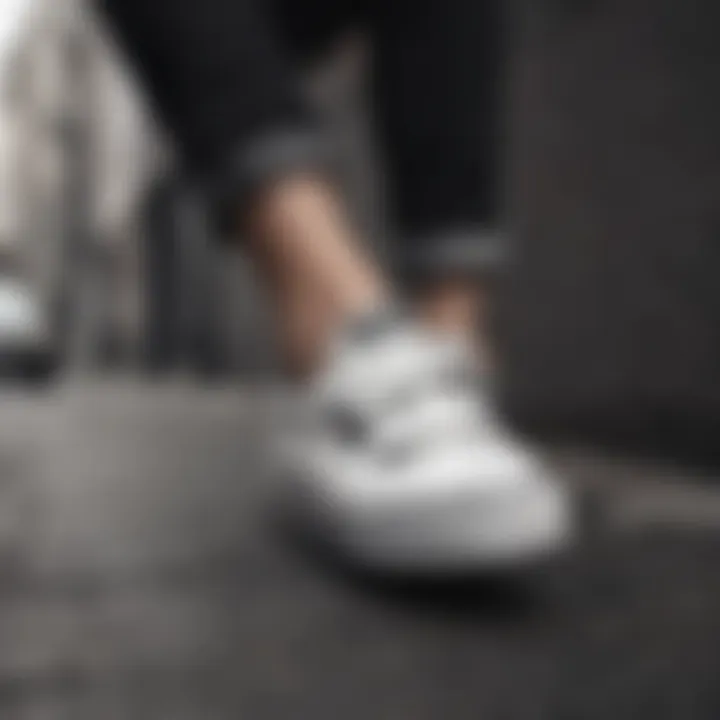 Woman styling black and white Velcro Vans in urban setting