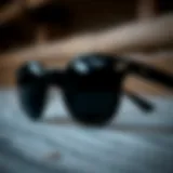 A close-up view of black round Ray-Ban sunglasses showcasing their unique frame design and lens quality.