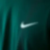 Fabric Texture of Dark Green Nike Shirt Close-up view of the dark green Nike shirt showcasing fabric texture