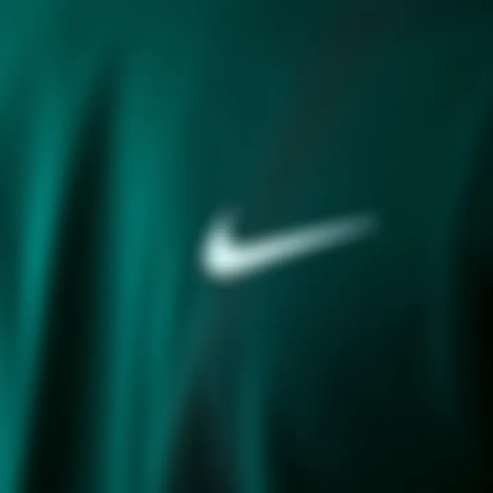 Fabric Texture of Dark Green Nike Shirt Close-up view of the dark green Nike shirt showcasing fabric texture