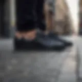 Stylish black Adidas Superstar shoes on a city street