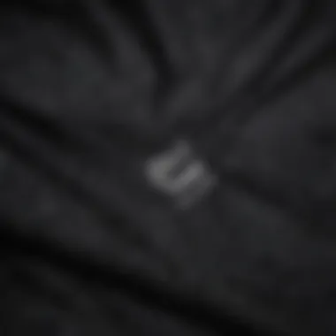 Close-up of the fabric texture of the black Nike hooded sweatshirt