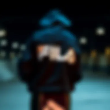 Artistic Representation of the Fila Black Hoodie An artistic view of a Fila black hoodie draped over a skateboard