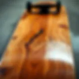 A close-up of an unfinished skateboard deck showcasing its raw wood texture.
