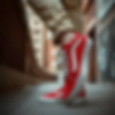 Stylish Individual Wearing Red and White Old Skool Vans in Urban Setting Stylish individual wearing red and white Old Skool Vans in urban setting