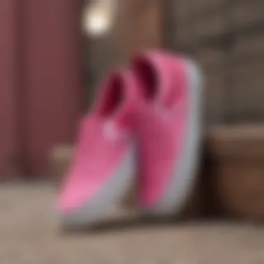 The Unique Design of Hot Pink Slip-On Vans A close-up view of hot pink slip-on Vans showcasing their unique texture and design.