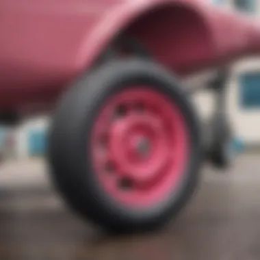 Close-up view of Pink Spitfire Wheels showcasing their vibrant color and design