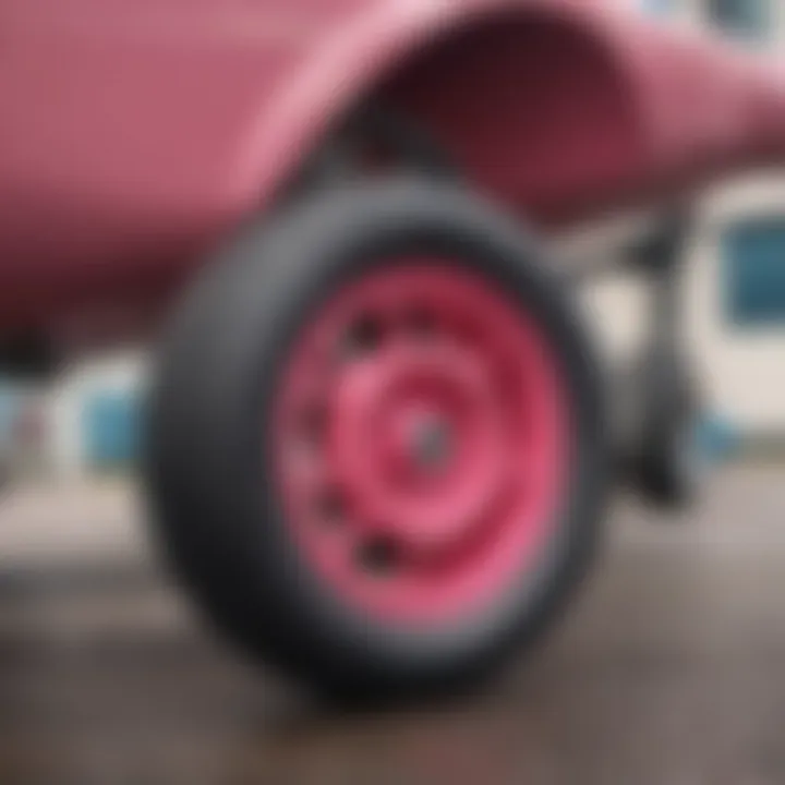 Close-up view of Pink Spitfire Wheels showcasing their vibrant color and design