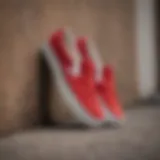 Close-up of red suede Vans slip-ons showcasing texture