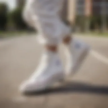 Skater performing tricks wearing all-white Converse sneakers