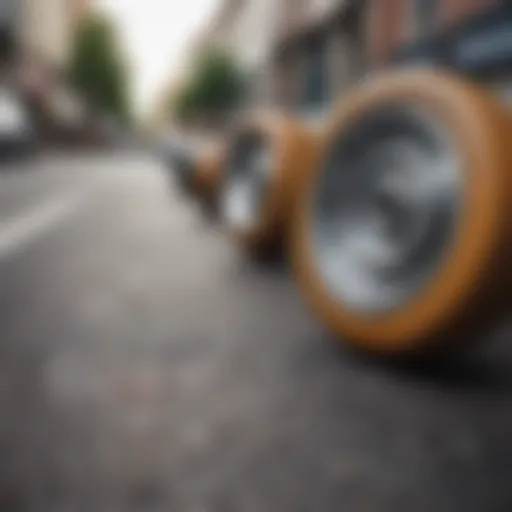 A close-up of skateboard wheels on a textured street surface