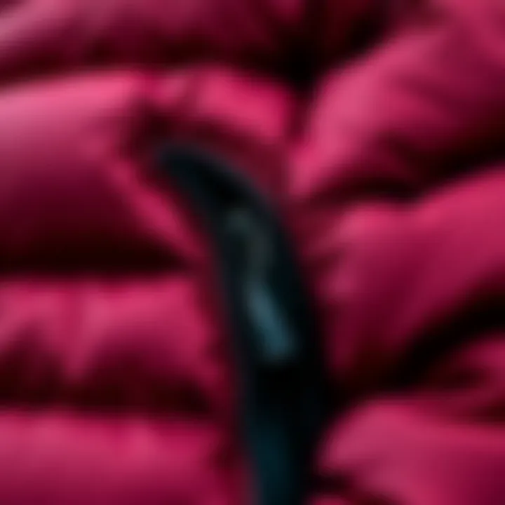 Intricate Details of the Maroon Puffer Jacket A close-up of the maroon puffer jacket showcasing its intricate stitching and fabric texture.