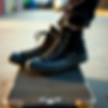 Black Converse high tops on skateboard deck