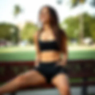 Casual Comfort in Black Sweatshorts Woman enjoying leisure time in black sweatshorts at a park