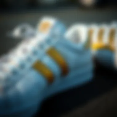 Intricacies of Design in White and Gold Adidas Shoes Close-up of white and gold Adidas shoes showcasing intricate design details