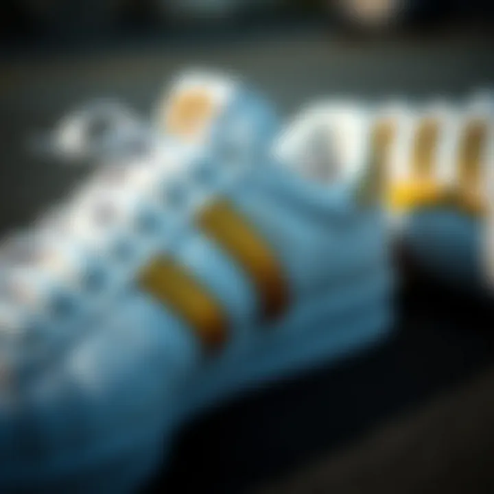 Intricacies of Design in White and Gold Adidas Shoes Close-up of white and gold Adidas shoes showcasing intricate design details